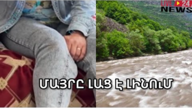 Мать сестер, упавших в реку, рыдает и плачет.